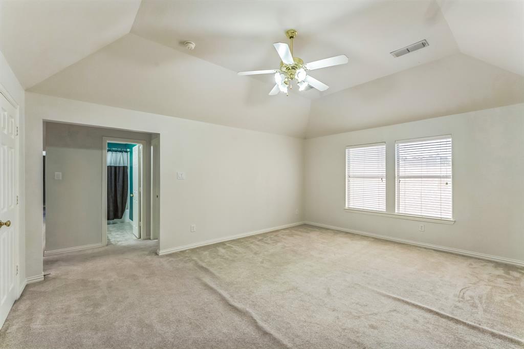 1611 Long Prairie Court Allen, TX 75002 - Photo 23 of 32 an empty room with chandelier fan