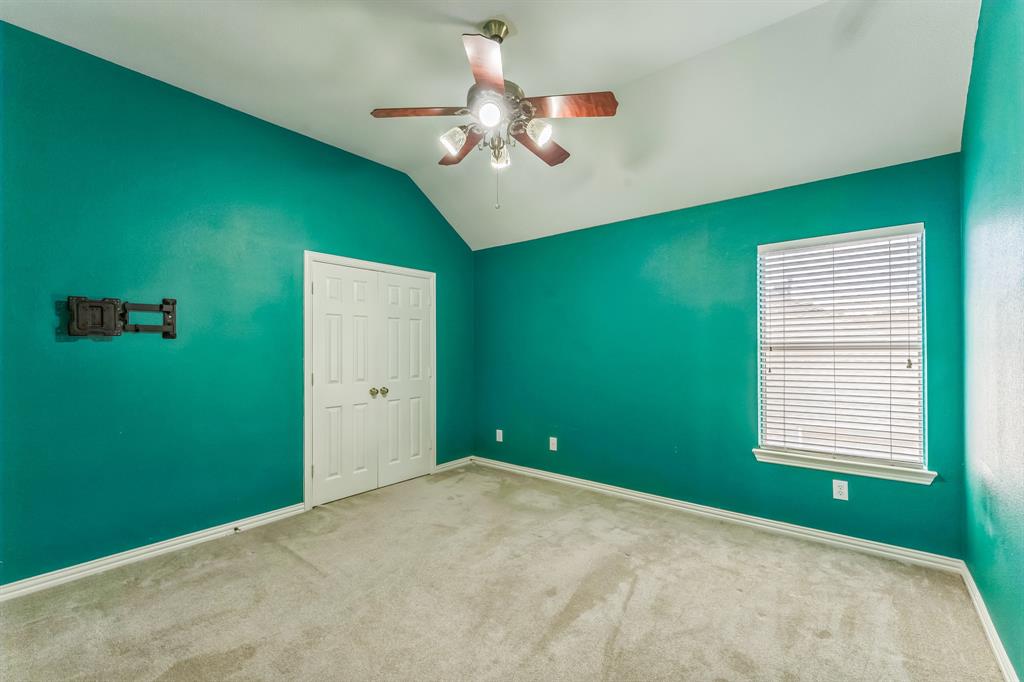 1611 Long Prairie Court Allen, TX 75002 - Photo 25 of 32 a view of a livingroom with an empty space and a window