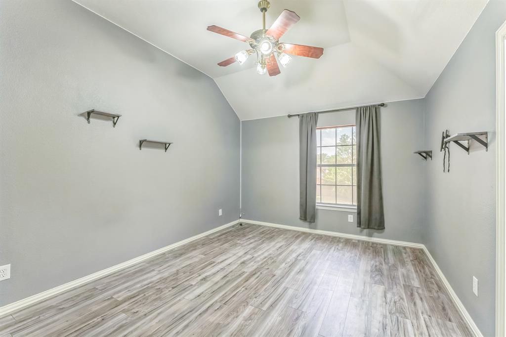 1611 Long Prairie Court Allen, TX 75002 - Photo 27 of 32 wooden floor in an empty room with a window