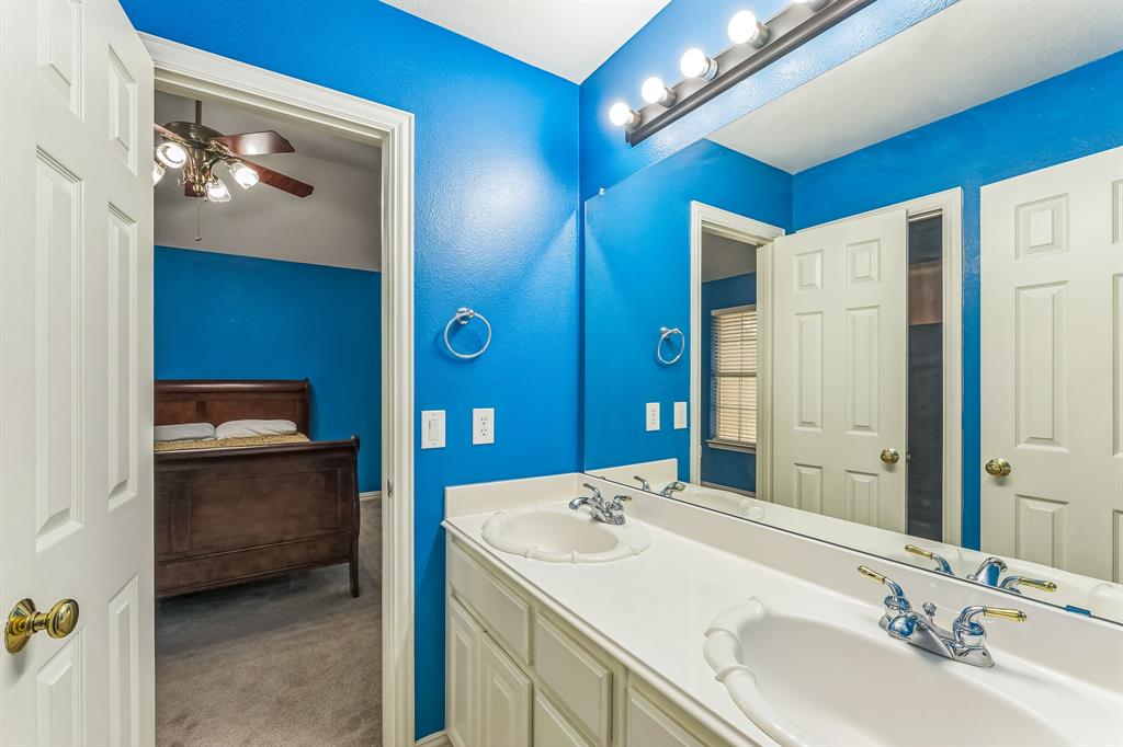 1611 Long Prairie Court Allen, TX 75002 - Photo 29 of 32 a en suite bathroom with a sink double vanity and a mirror