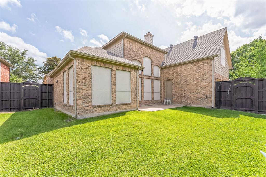 1611 Long Prairie Court Allen, TX 75002 - Photo 32 of 32 a view of a house with a yard and wooden fence