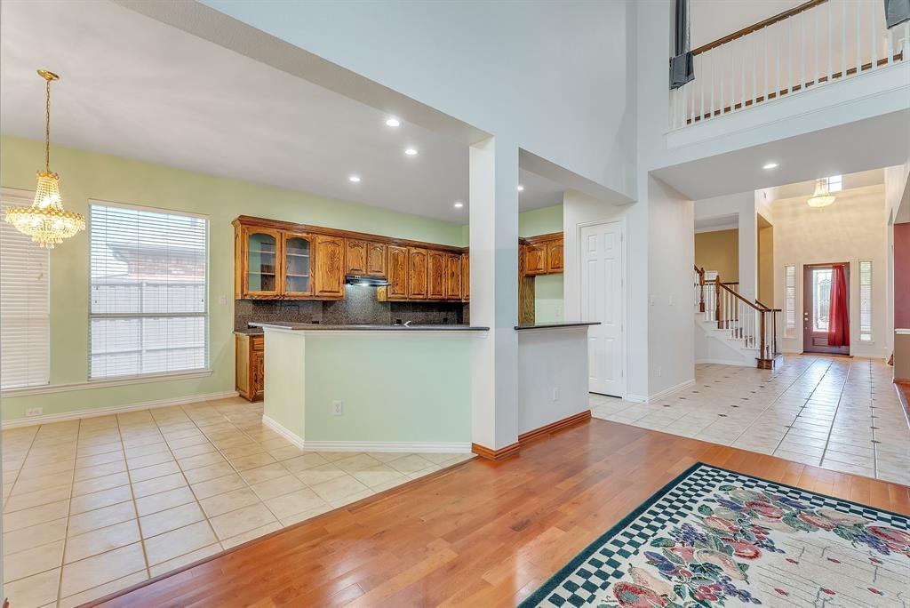 1611 Long Prairie Court Allen, TX 75002 - Photo 4 of 32 a view of a kitchen with a sink and an empty room