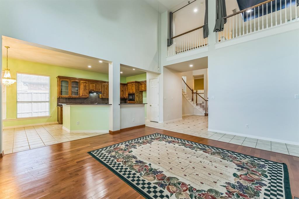 1611 Long Prairie Court Allen, TX 75002 - Photo 8 of 32 wooden floor in a hall with an entryway