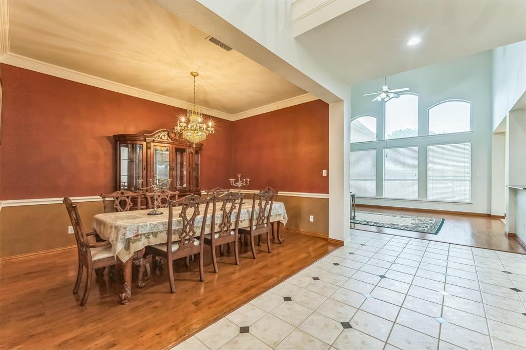 1611 Long Prairie Court Allen, TX 75002 - Photo 10 of 32 a view of a dining room with furniture window and wooden floor