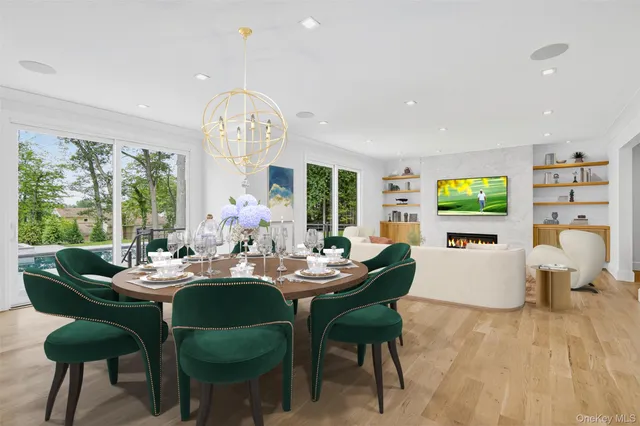 a kitchen with stainless steel appliances granite countertop a stove and a large window