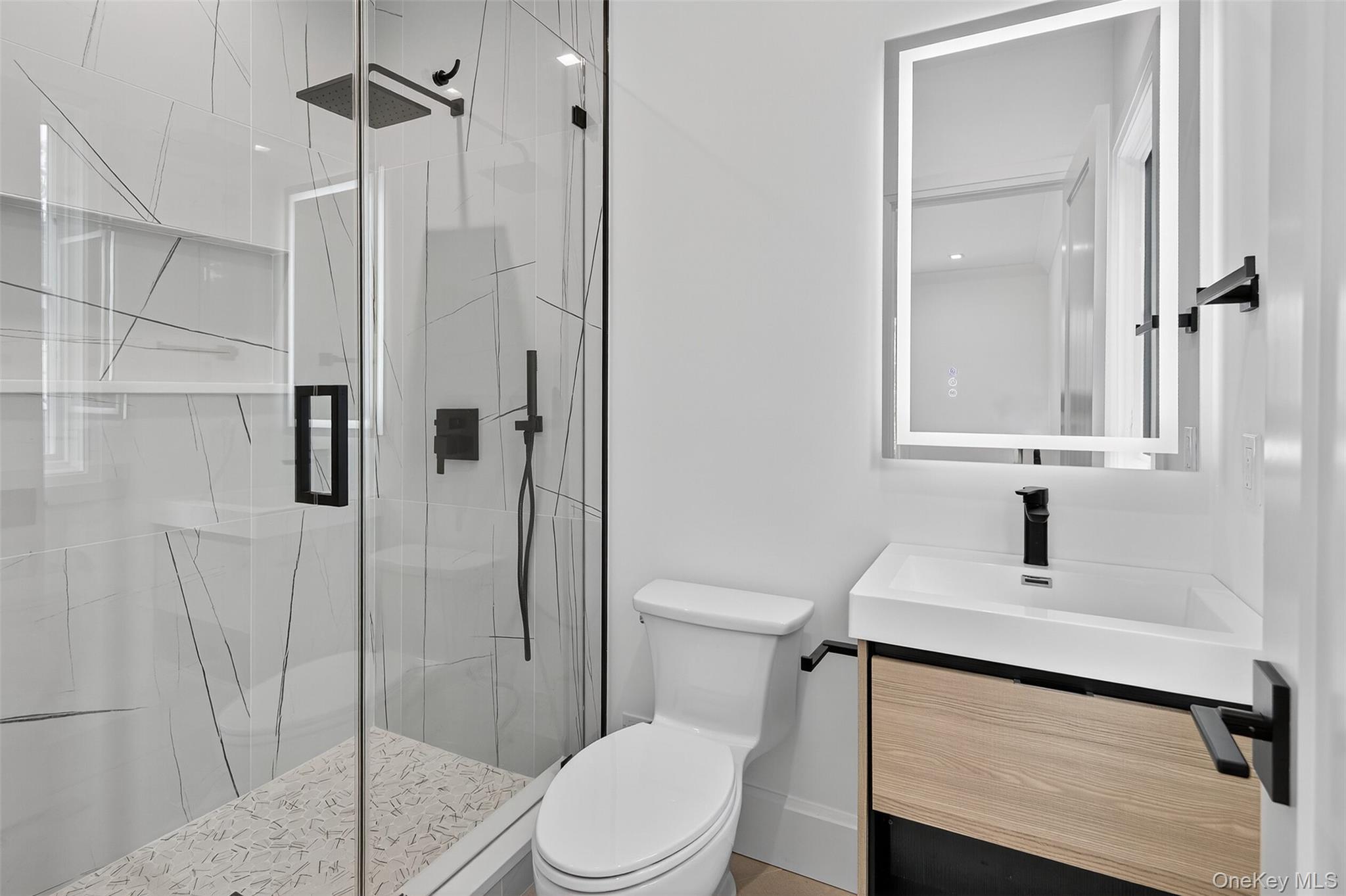 32 A Pine Road Syosset, NY 11791 - Photo 22 of 46 a bathroom with a sink a toilet and shower