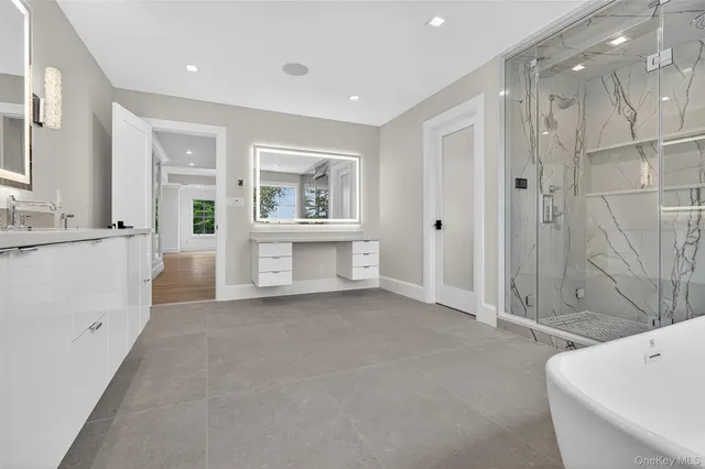 a bathroom with a toilet sink and shower