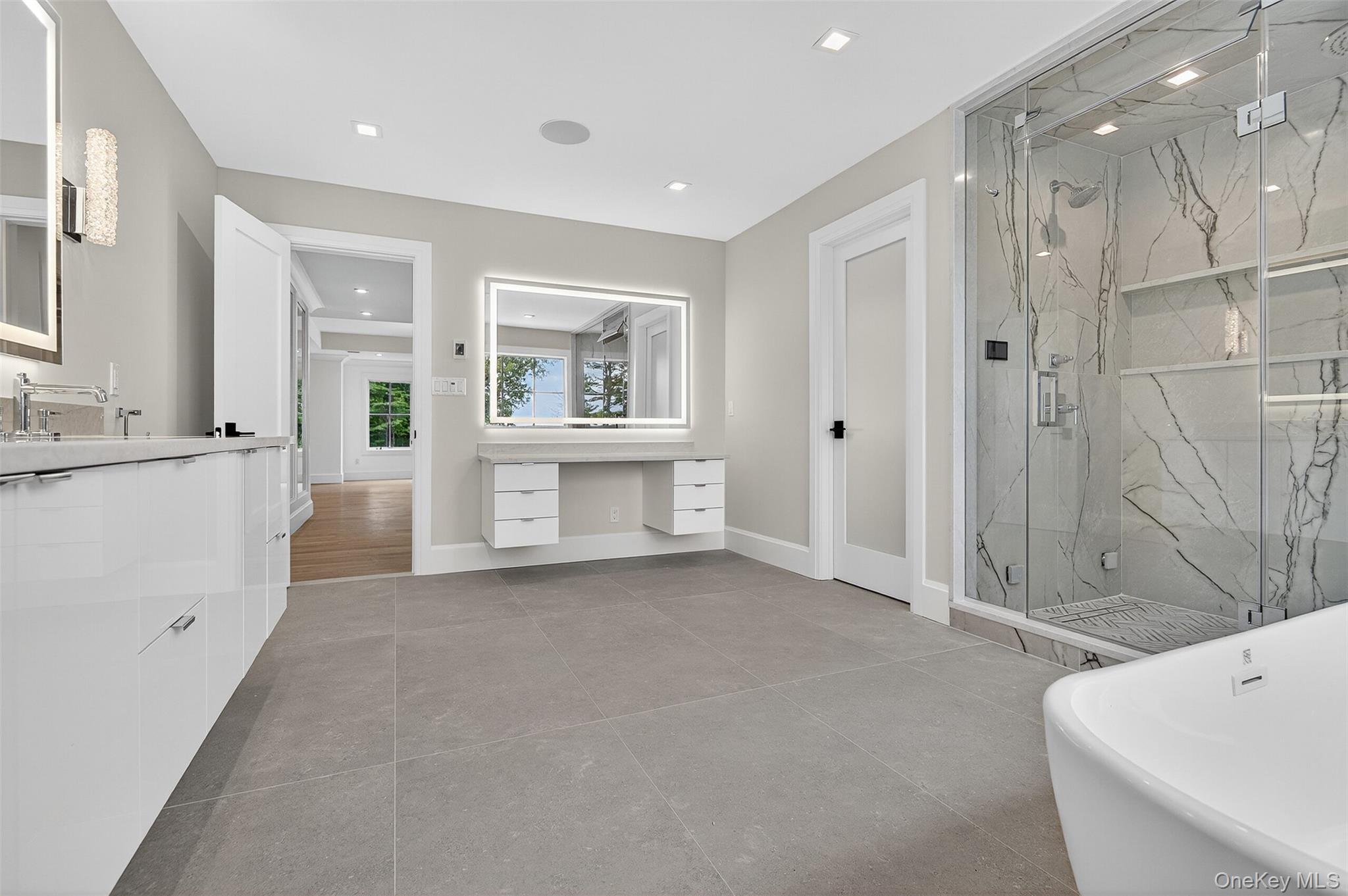 32 A Pine Road Syosset, NY 11791 - Photo 27 of 46 a view of a bathroom with bathtub and shower