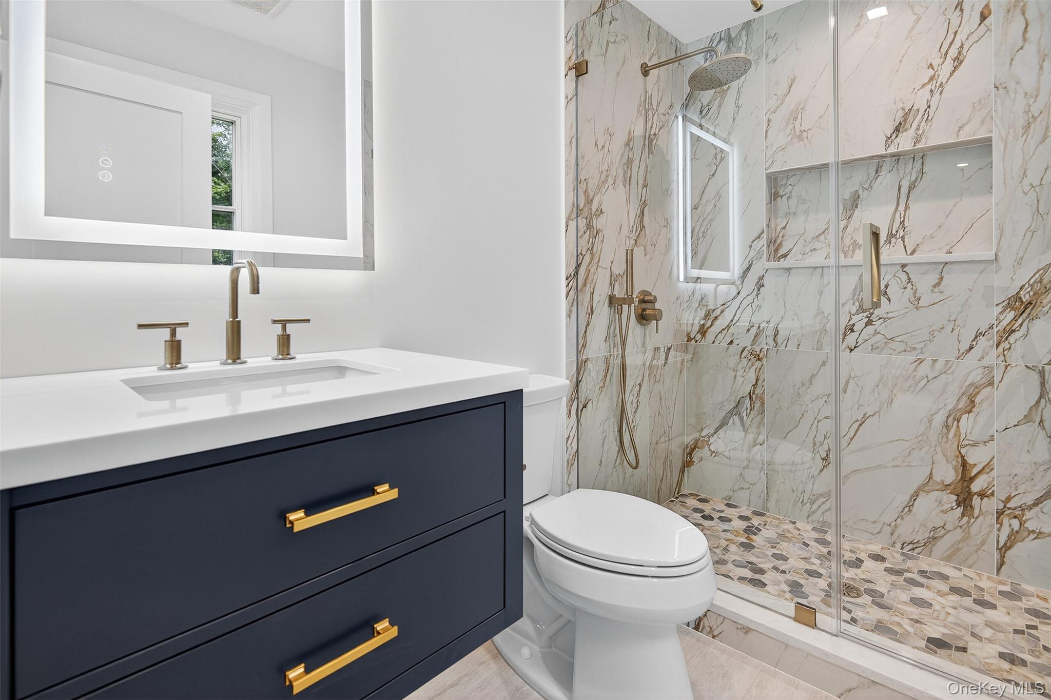 32 A Pine Road Syosset, NY 11791 - Photo 32 of 46 a bathroom with a sink a toilet and shower