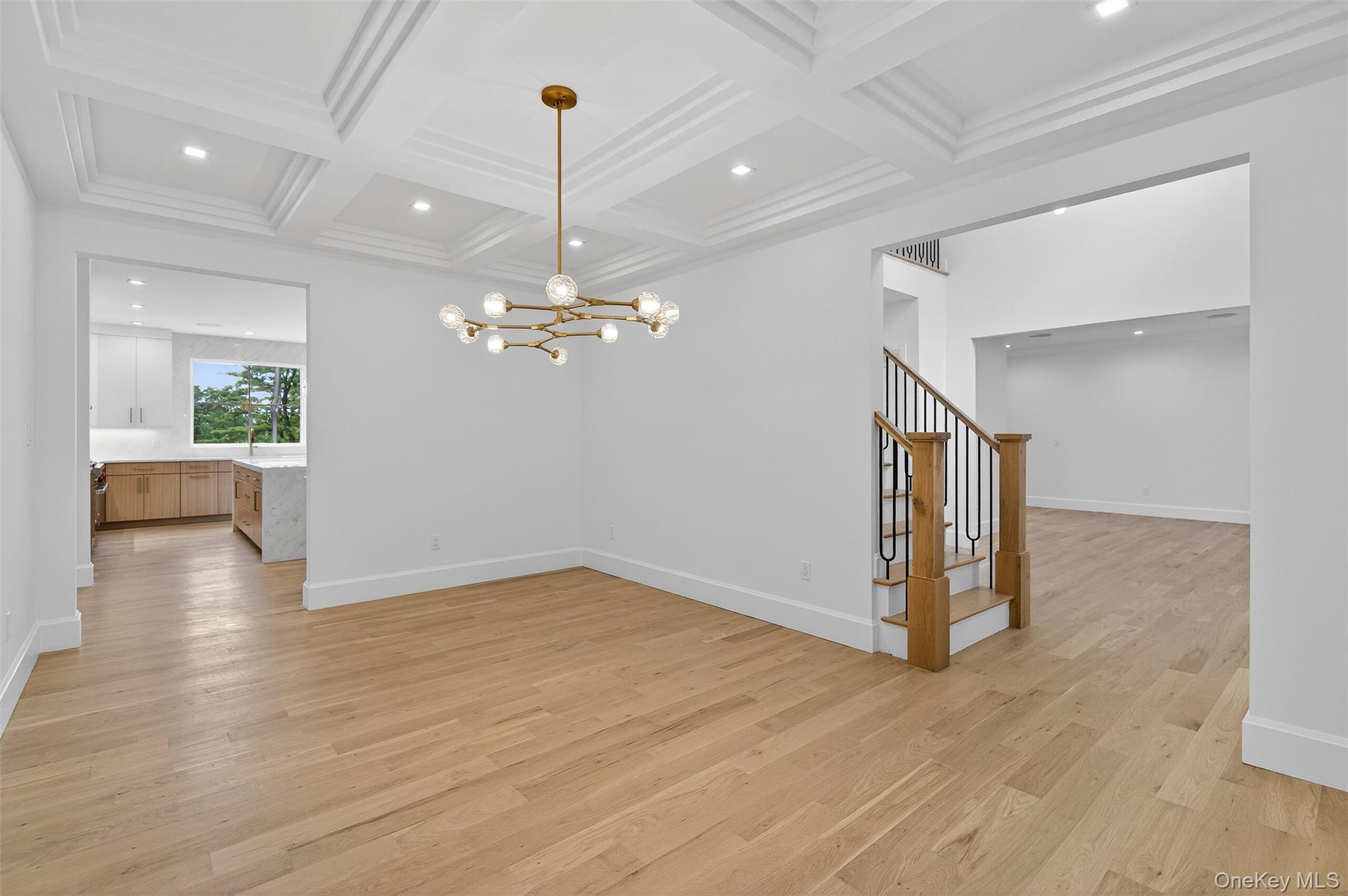 32 A Pine Road Syosset, NY 11791 - Photo 7 of 46 a view of a room with wooden floor staircase and a kitchen