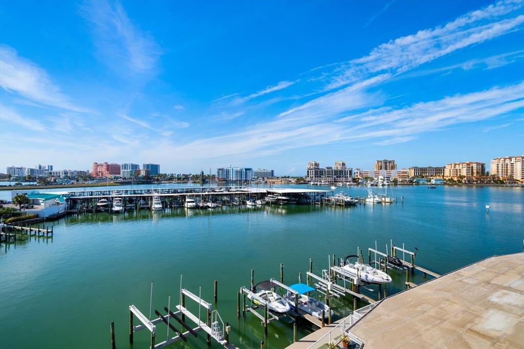 211 Dolphin Point, Unit 2 Clearwater, FL 33767 - Photo 11 of 16 a view of a lake with houses