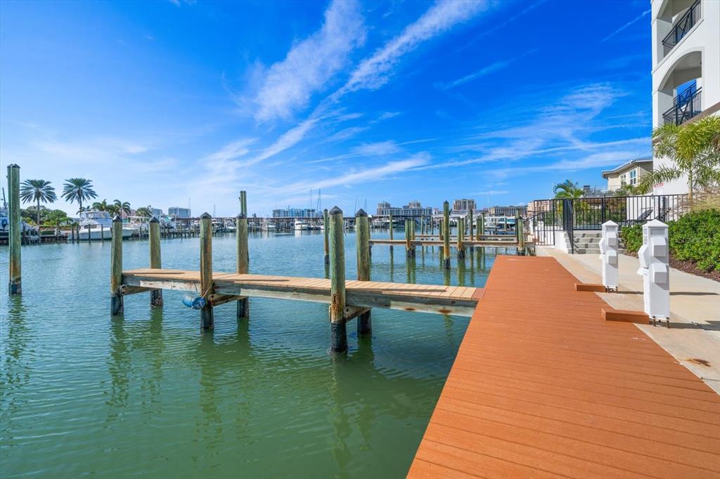 211 Dolphin Point, Unit 2 Clearwater, FL 33767 - Photo 2 of 16 a park view with a sitting space