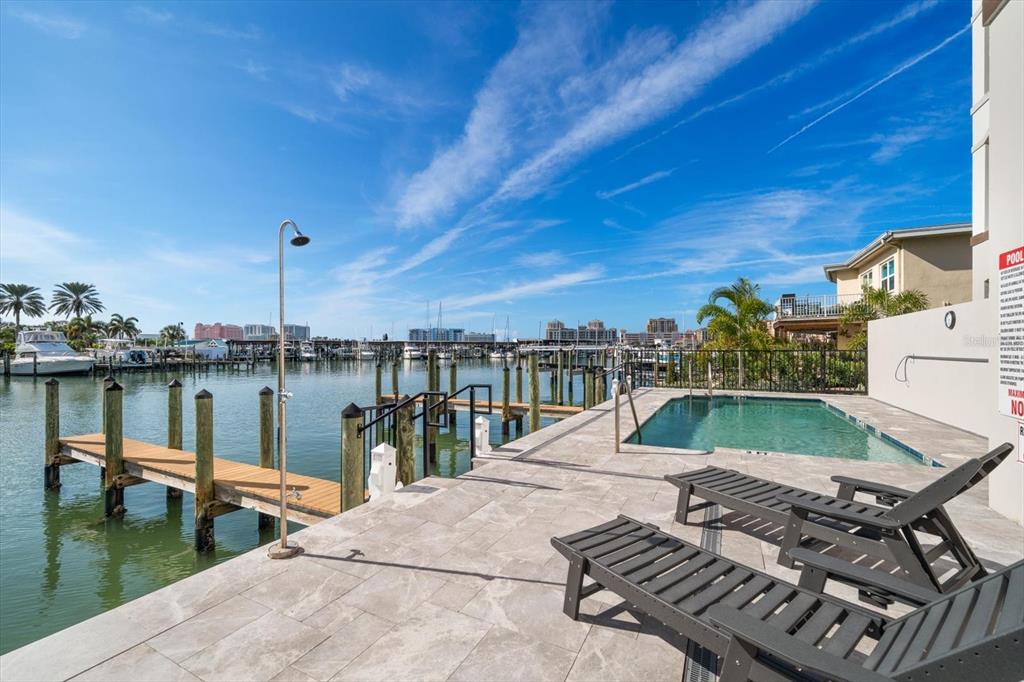 211 Dolphin Point, Unit 2 Clearwater, FL 33767 - Photo 3 of 16 a view of a lake with a patio