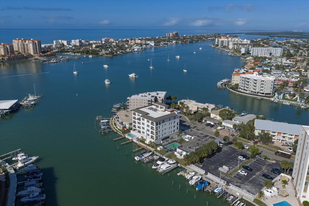 211 Dolphin Point, Unit 2 Clearwater, FL 33767 - Photo 7 of 16 an aerial view of a houses with a lake