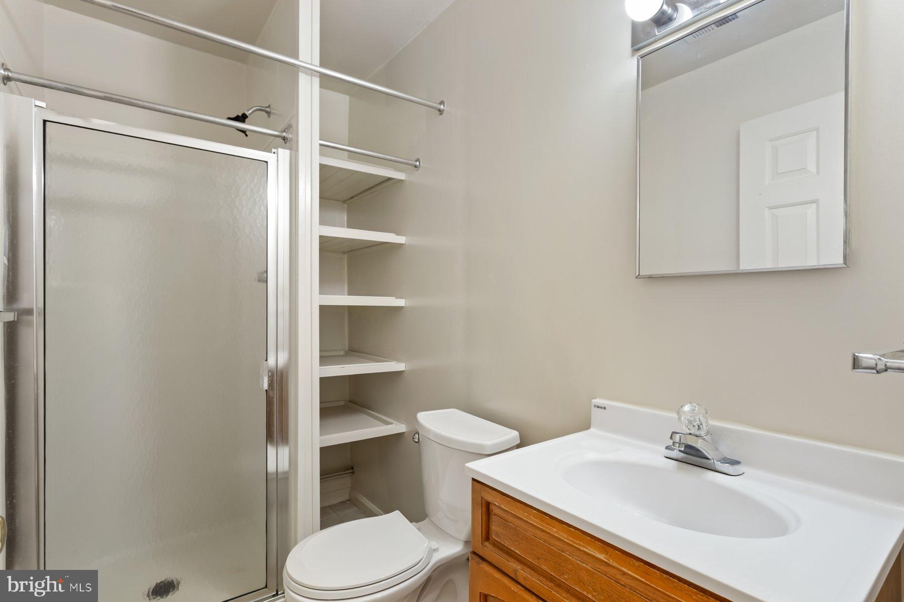 12907 Hawkshead Terrace Silver Spring, MD 20904 - Photo 27 of 30 a bathroom with a sink toilet and shower
