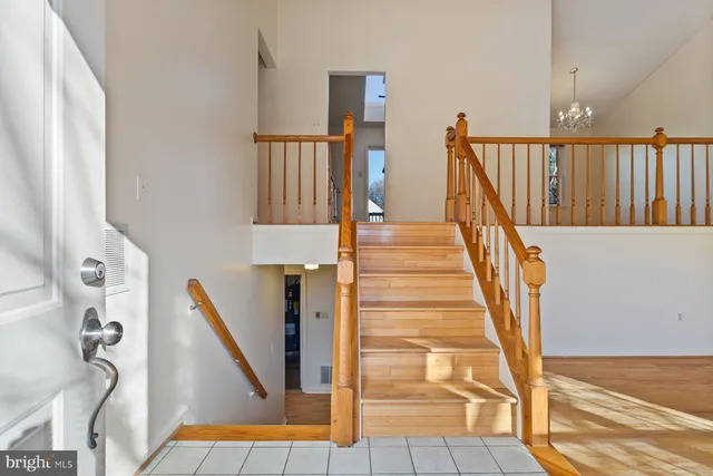 a view of a room with wooden floor and windows