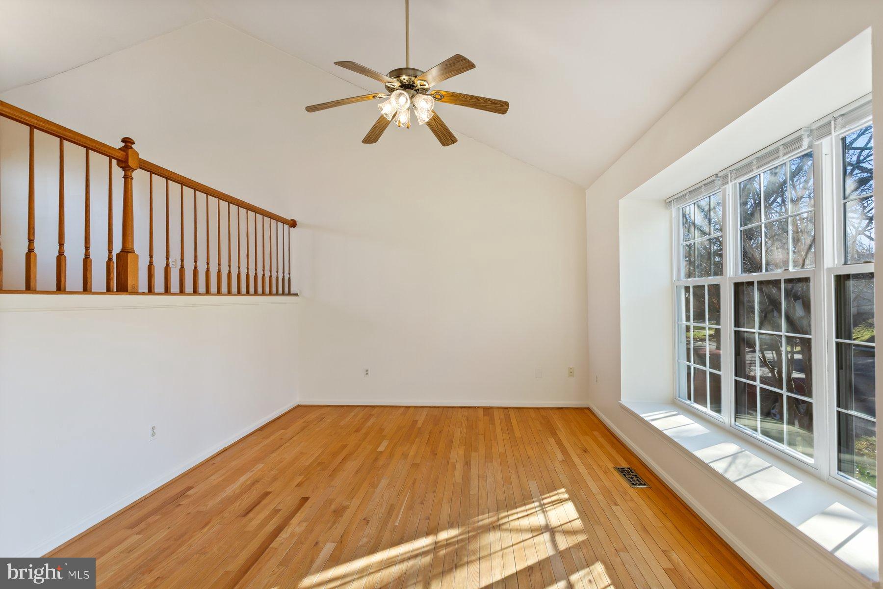 12907 Hawkshead Terrace Silver Spring, MD 20904 - Photo 5 of 30 a view of a room with wooden floor and windows