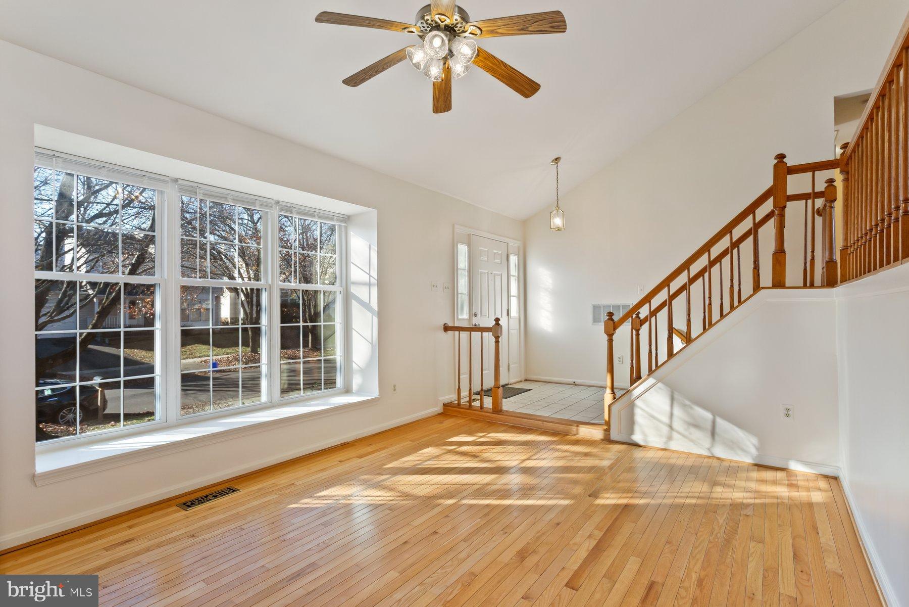 12907 Hawkshead Terrace Silver Spring, MD 20904 - Photo 7 of 30 a view of an empty room with wooden floor and a window