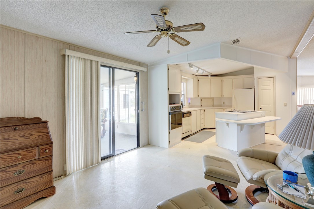 1064 Manila Drive Sebastian, FL 32976 - Photo 7 of 25 a view of kitchen with furniture and wooden floor