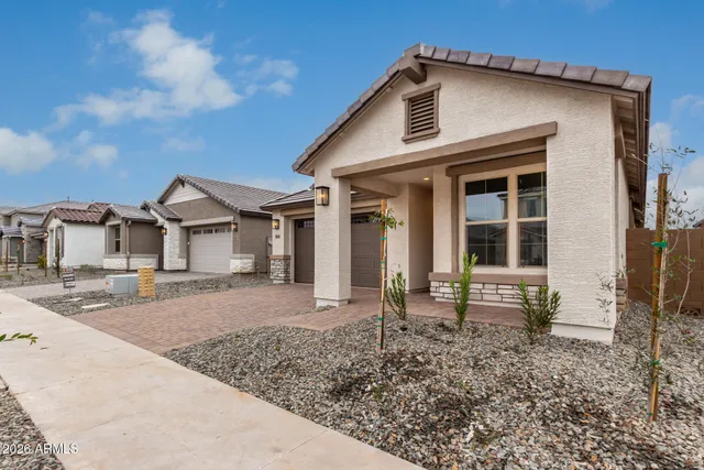a view of a hallway with wooden floor and closet area