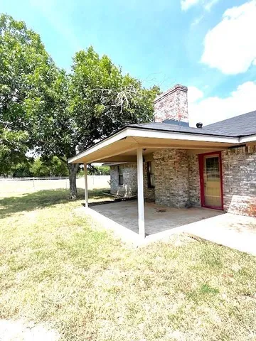 a house with trees in front of it