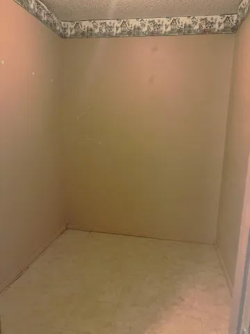 a bathroom with a shower and a toilet