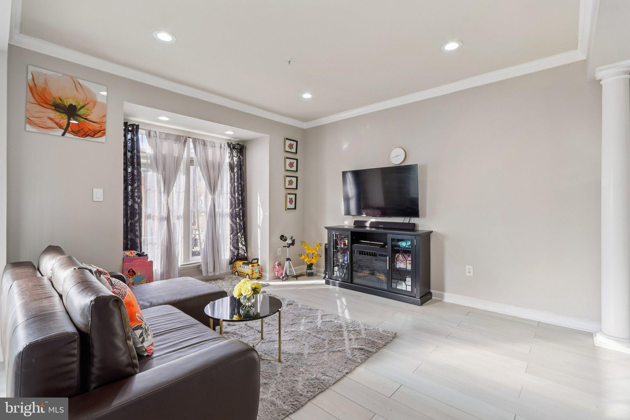14209 Parker Farm Way Silver Spring, MD 20906 - Photo 16 of 57 a living room with furniture and a flat screen tv