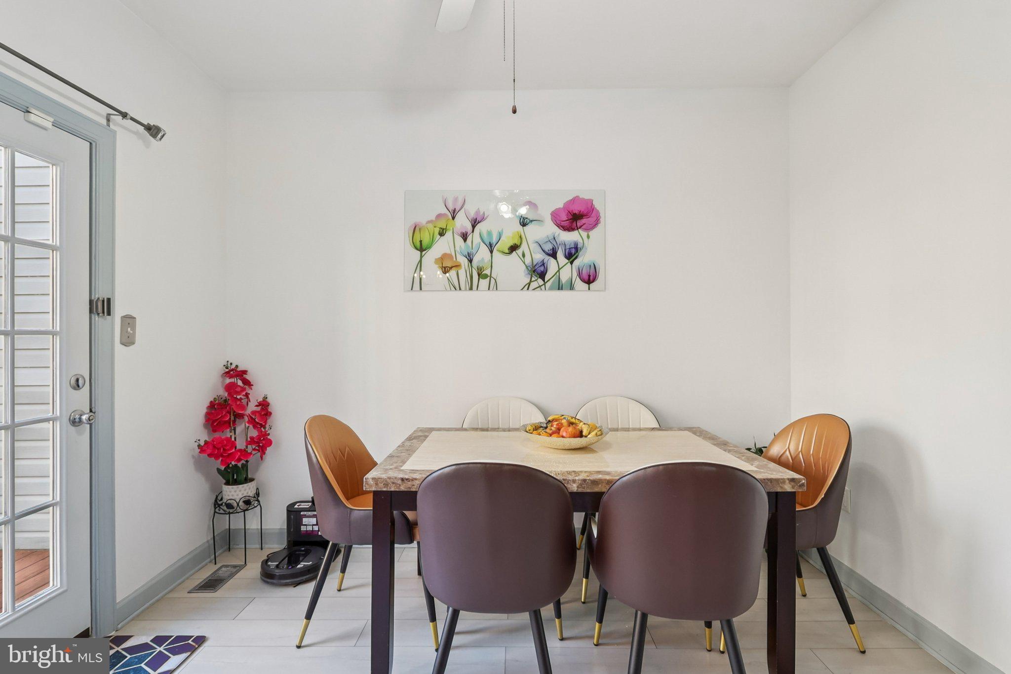 14209 Parker Farm Way Silver Spring, MD 20906 - Photo 18 of 57 a view of a dining room with furniture and wooden floor