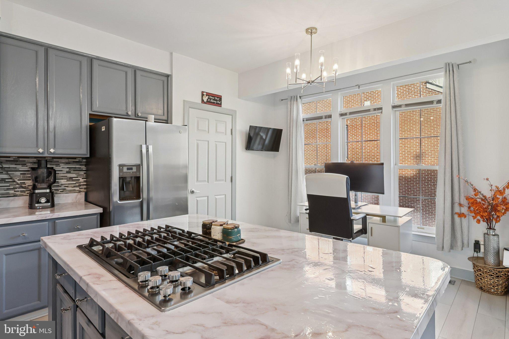14209 Parker Farm Way Silver Spring, MD 20906 - Photo 22 of 57 a kitchen with a stove a refrigerator and a stove