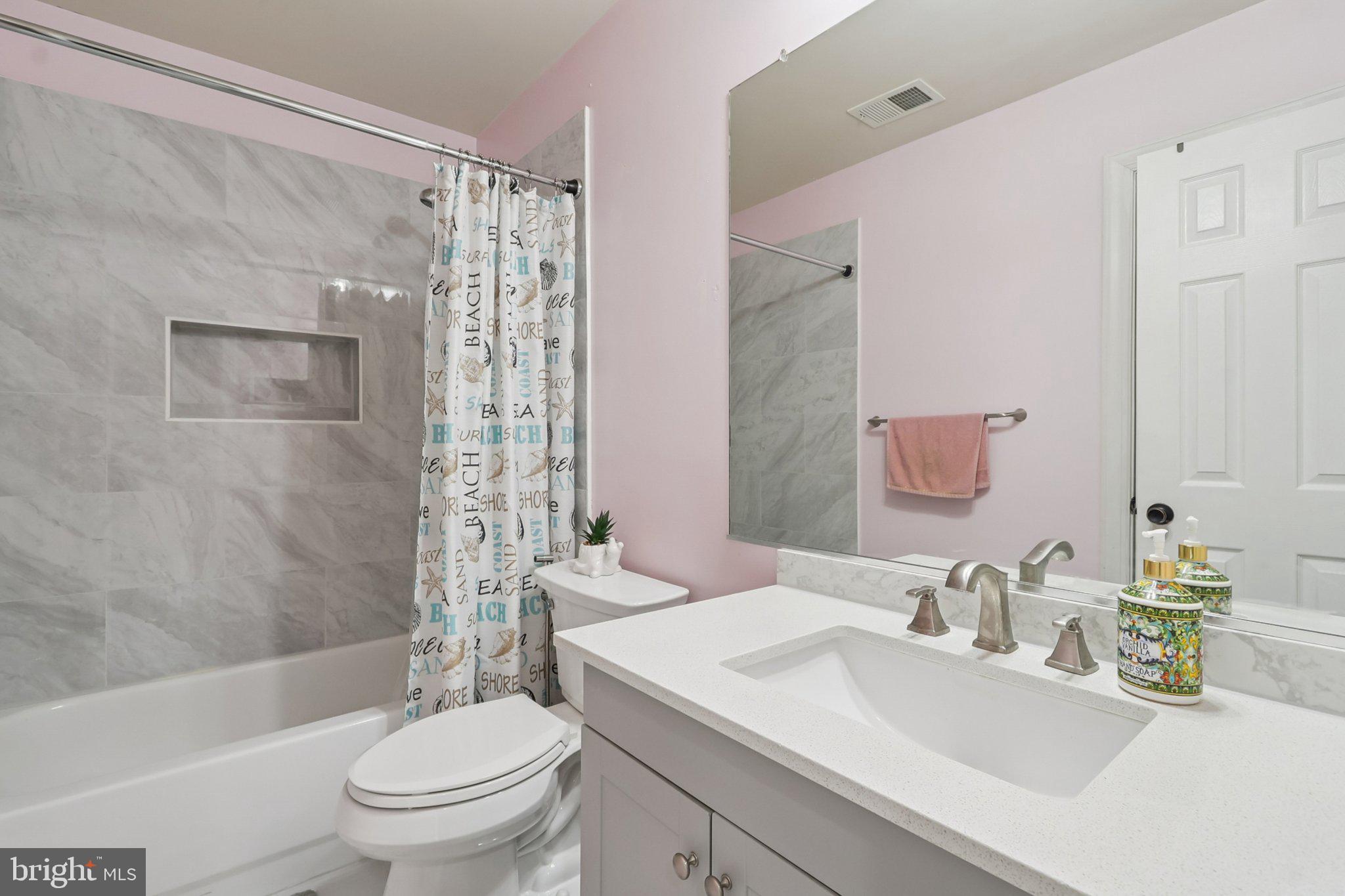 14209 Parker Farm Way Silver Spring, MD 20906 - Photo 39 of 57 a bathroom with a sink toilet and shower