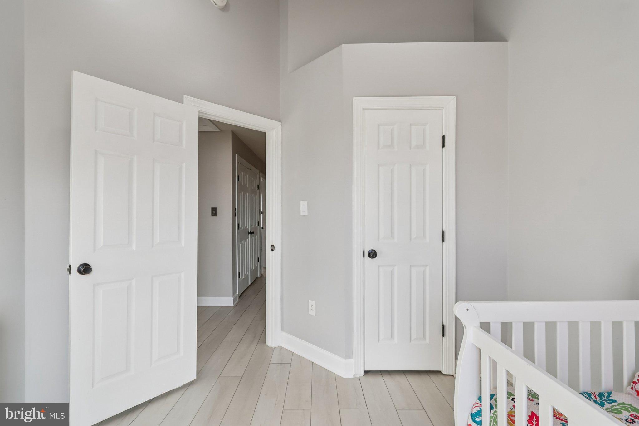 14209 Parker Farm Way Silver Spring, MD 20906 - Photo 44 of 57 a view of a bedroom with wooden floor