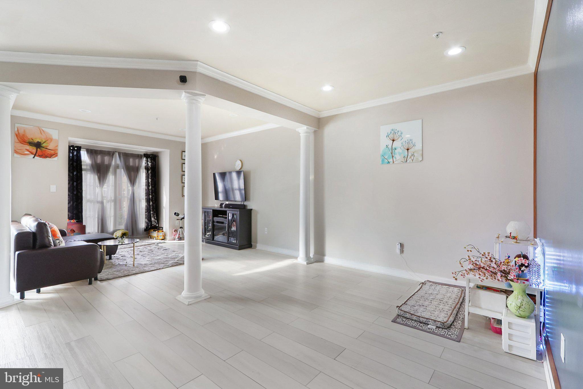 14209 Parker Farm Way Silver Spring, MD 20906 - Photo 10 of 57 a living room with furniture and a wooden floor