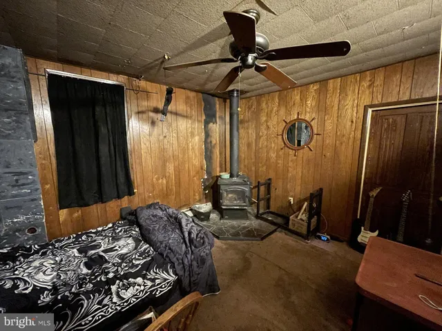 a bed room with a bed and a chair