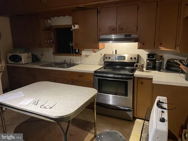 a kitchen with a stove and a sink