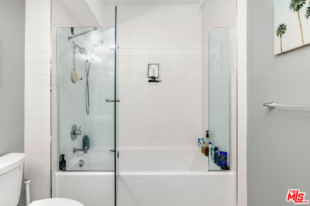 4215 Glencoe Avenue, Unit 206 Marina del Rey, CA 90292 - Photo 13 of 21 a bathroom with a bathtub with a shower