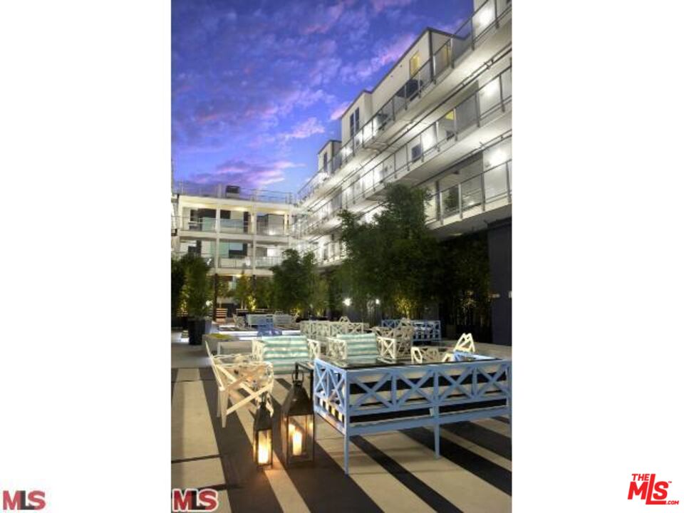 4215 Glencoe Avenue, Unit 206 Marina del Rey, CA 90292 - Photo 17 of 21 a view of a patio with table and chairs and potted plants