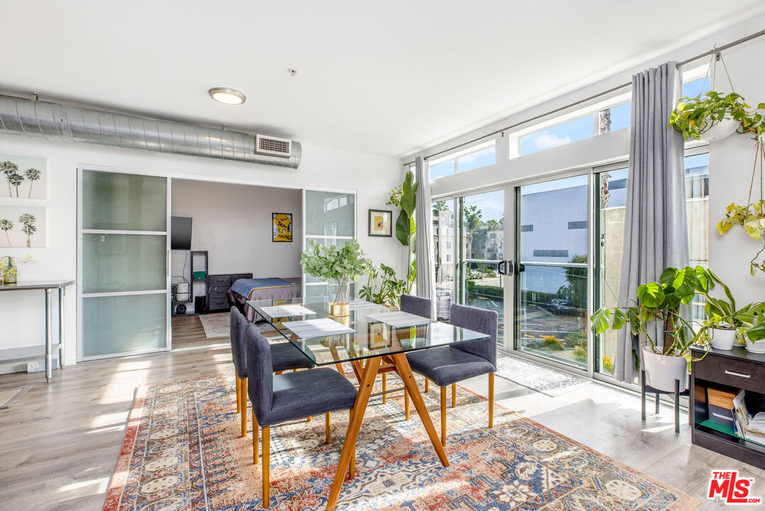 4215 Glencoe Avenue, Unit 206 Marina del Rey, CA 90292 - Photo 4 of 21 a view of a dining room with furniture window and wooden floor