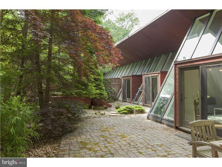 311 State Road Princeton, NJ 08540 - Photo 22 of 25 a backyard of a house with table and chairs