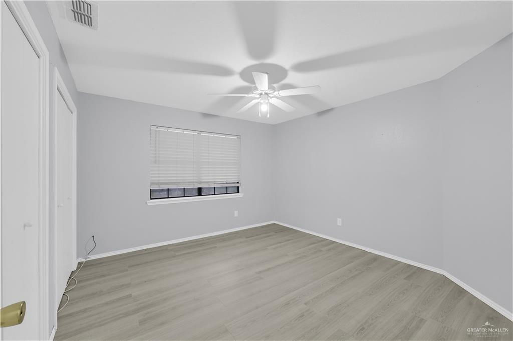 1901 Robin Avenue McAllen, TX 78504 - Photo 10 of 16 an empty room with a window and a ceiling fan