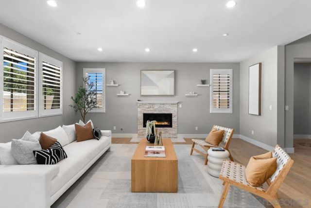 a kitchen with kitchen island granite countertop a sink and stainless steel appliances