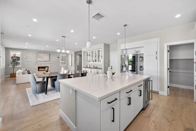 a kitchen with stainless steel appliances granite countertop a stove and a cabinets