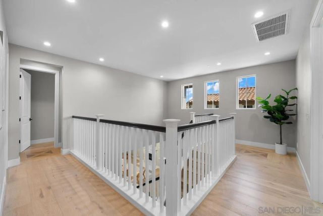 a view of empty room with windows