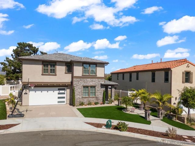 a front view of a house with yard
