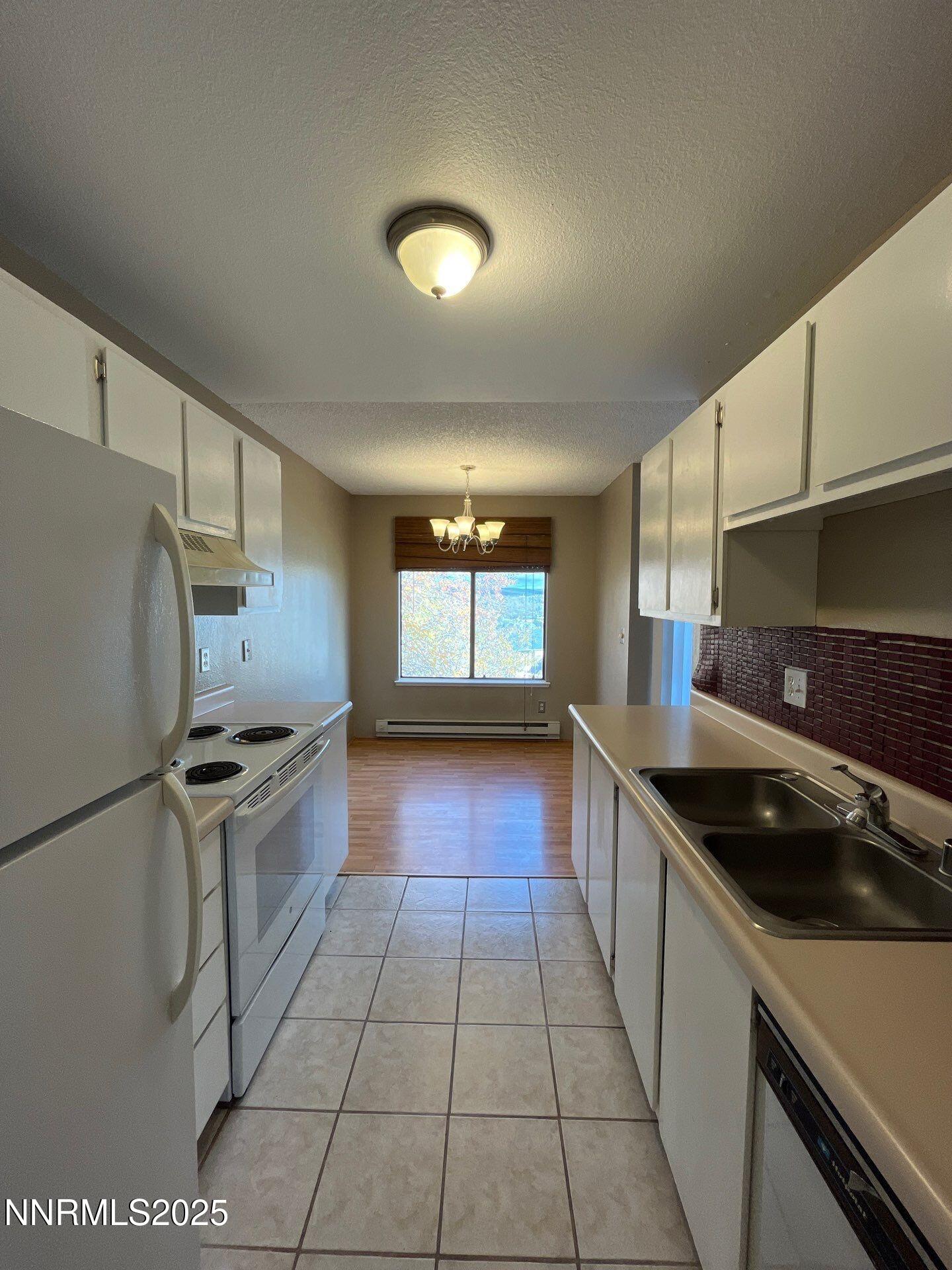 3885 East Leonesio Drive, Unit A2 Reno, NV 89512 - Photo 6 of 12 Leonesio kitchen dining room