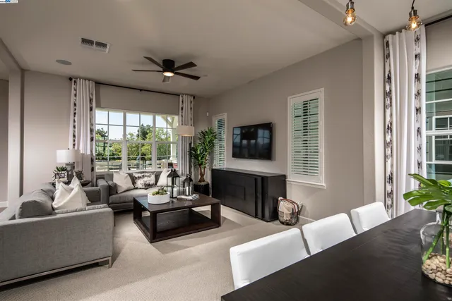 a bedroom with a bed and a chair