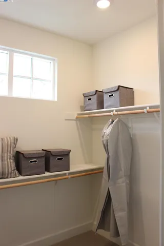 a bathroom with a sink mirror and vanity
