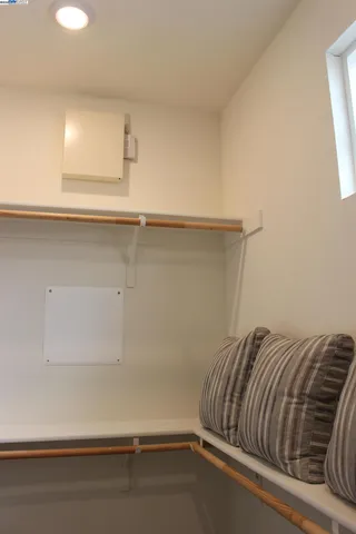 a bedroom with a bed and a table in it