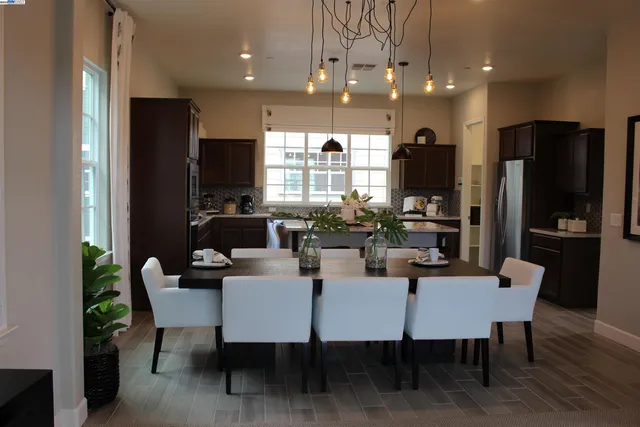 a kitchen with a sink dishwasher and cabinets