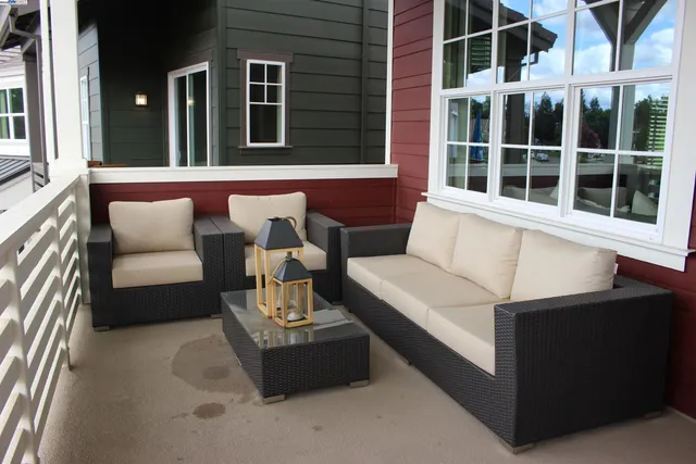 a view of balcony with furniture