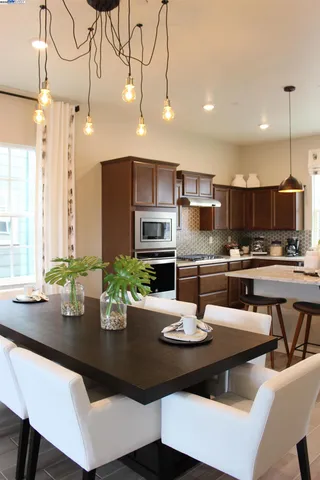 a white toilet sitting next to a window
